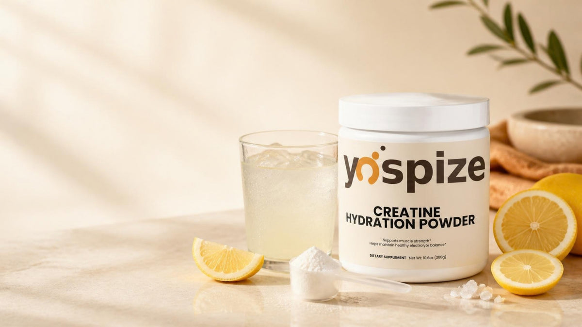 Yospize Creatine Hydration Powder tub with lemons and a glass of lemon drink